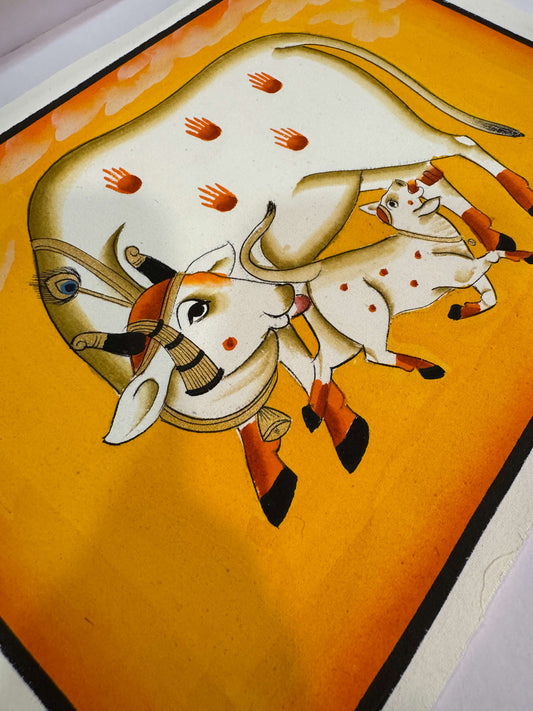 Cow and Calf in Devotional Embrace – Original Pichwai on Cotton Cloth | Hand-Painted in Golden Yellow