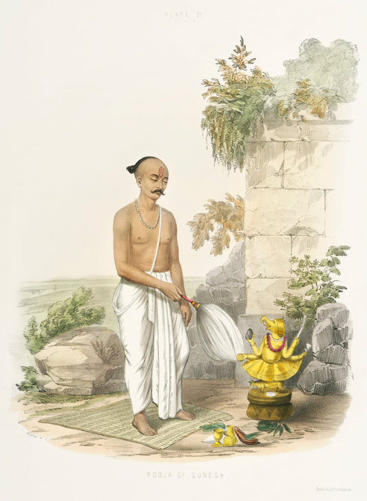 A standing worshipper in white rests beside a shrine and abundant flowers, framed by soft greenery and weathered stone.