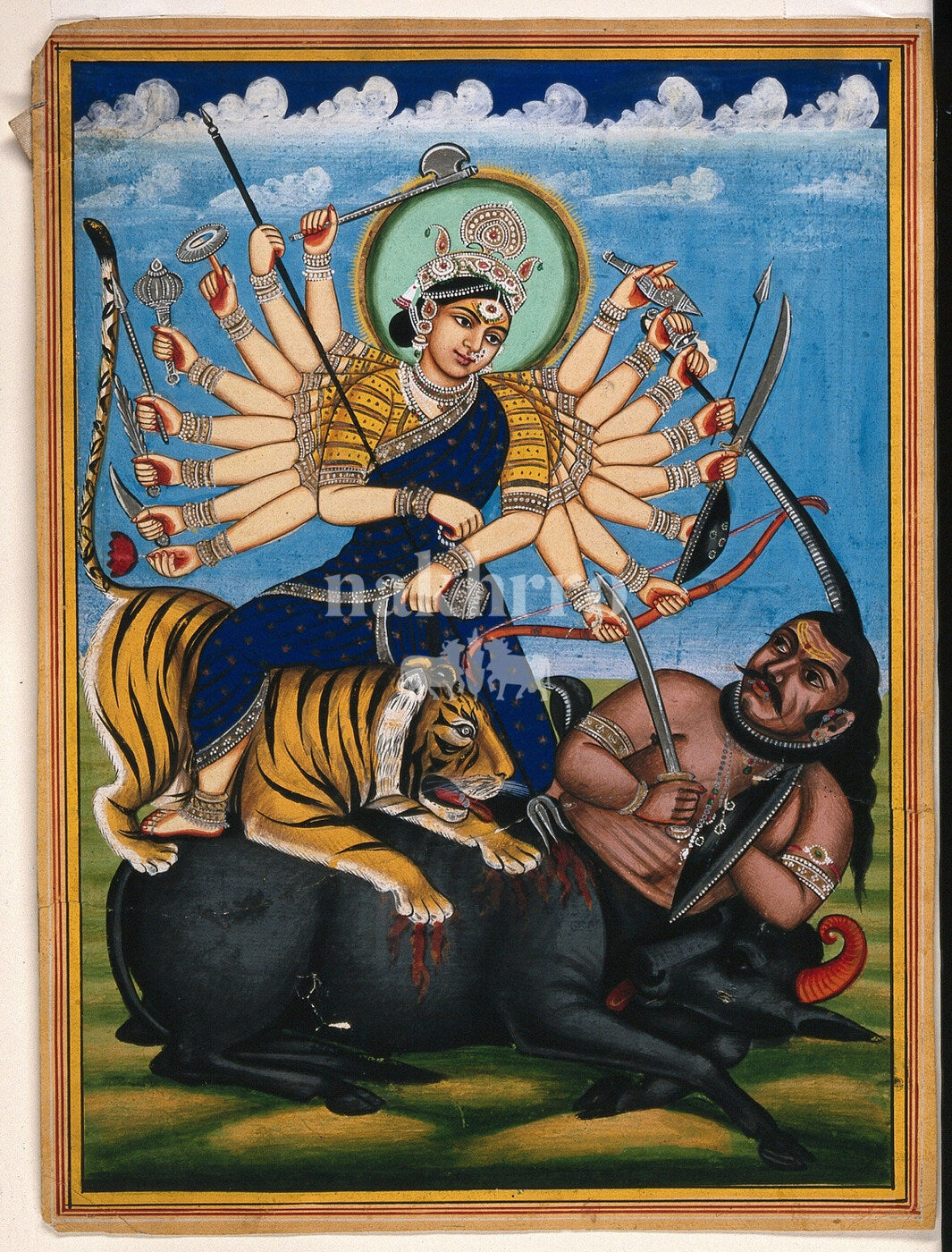 Goddess Durga riding a tiger and defeating Mahishasura