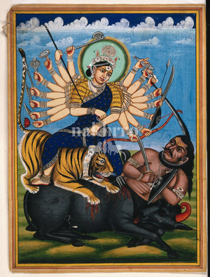 Goddess Durga riding a tiger and defeating Mahishasura