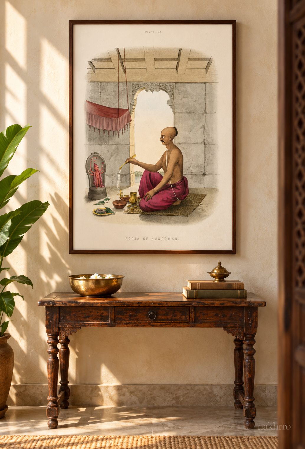 Hanuman worship print in a walnut frame above an antique console, styling mockup