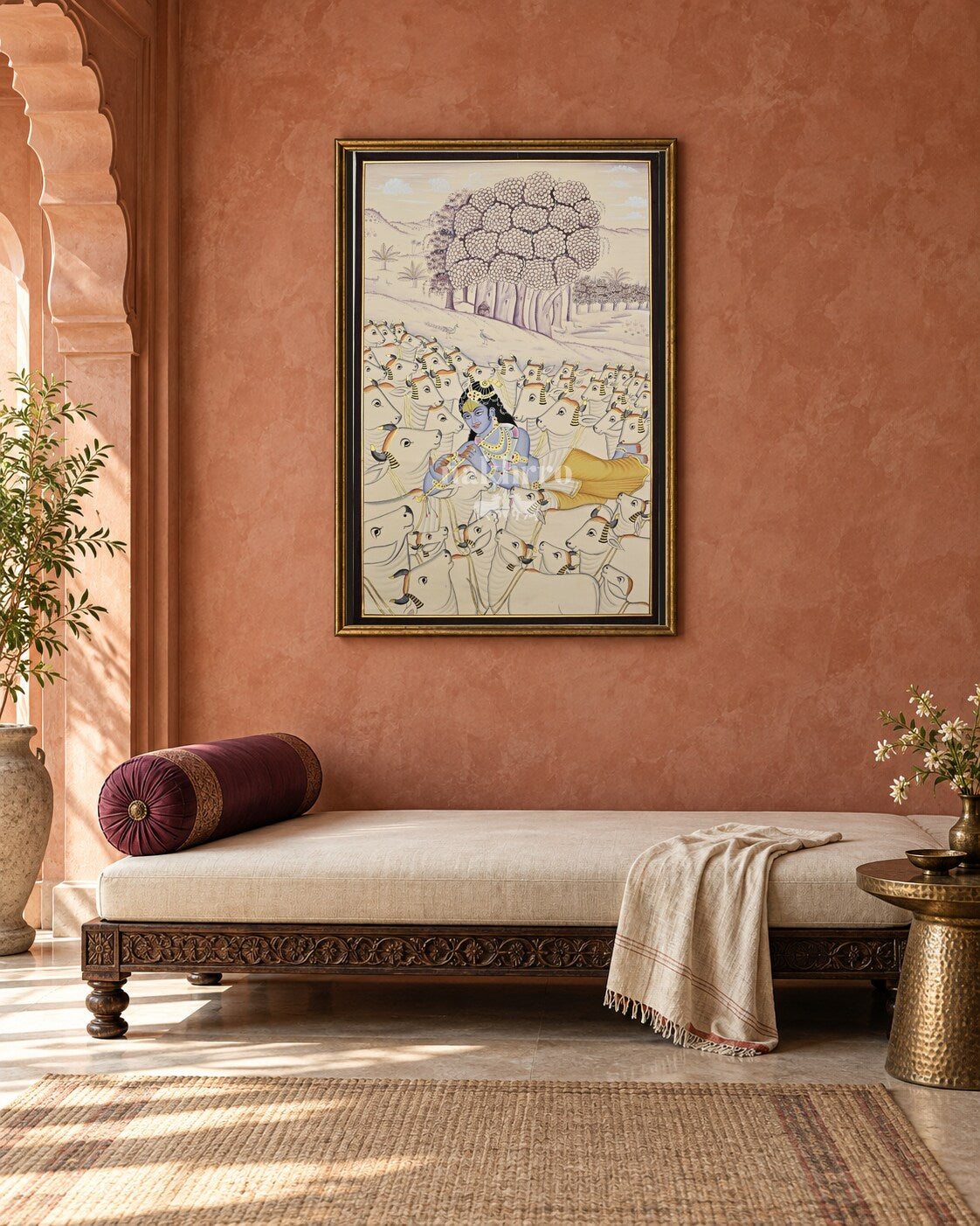 Krishna Among the Cows, framed above a daybed in a contemporary haveli interior; styling mockup
