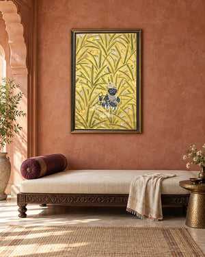 Krishna Among Golden Banana Leaves, framed above a daybed in a contemporary haveli; styling mockup, 2 by 3 feet