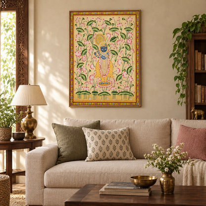 Krishna Among Pink Lotuses Pichwai print styled in a cosy Indian living room.