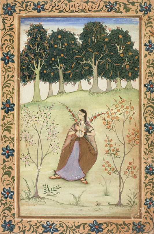 A woman and peacock stand in a pale garden beneath a row of trees, enclosed by a dense ornamental floral border.