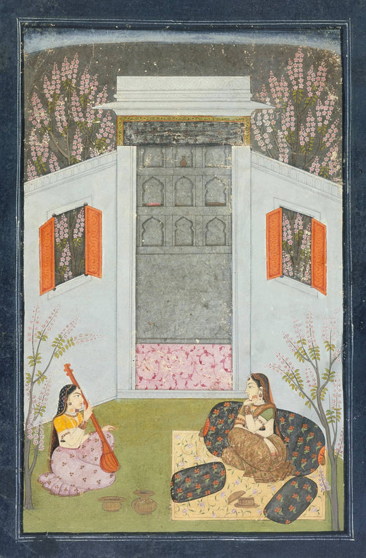 A woman sits on a pale terrace beside a tiger, while a tall pavilion rises into a dark moonlit sky.
