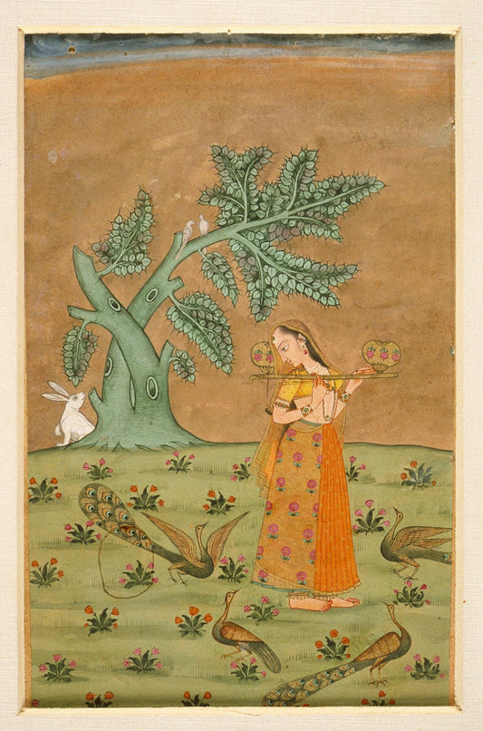 A musician in an ochre dress plays beneath an arching tree while deer and small birds animate the open landscape.