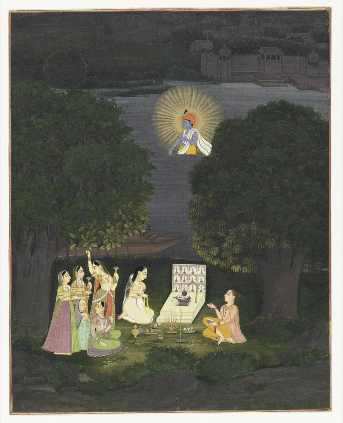 Women gathered for night worship of the Shivling in a forest setting