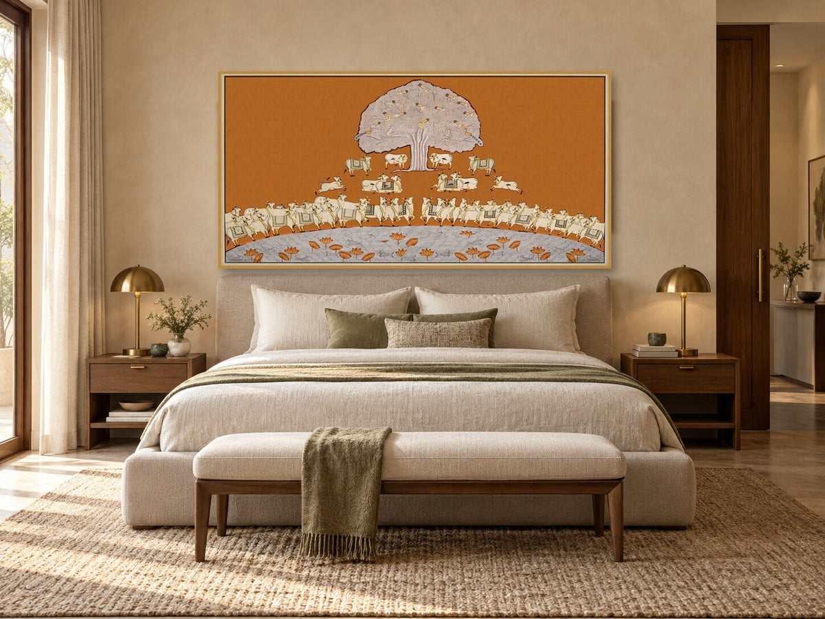 Ochre Tree of Life and cows Pichwai print displayed above a bed