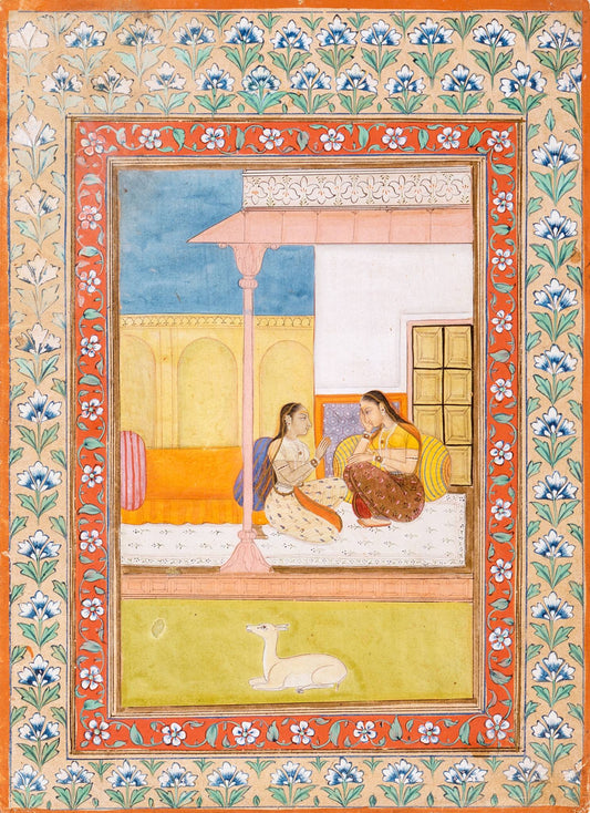 Two figures rest together in a pale palace setting, surrounded by intricate floral borders in blue, coral and gold tones.