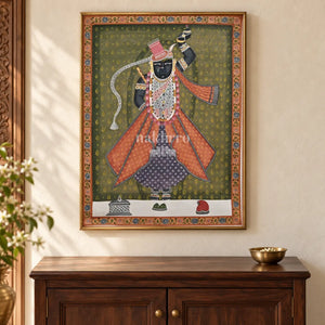 Shrinathji in Rose Robes on Olive — 18 × 24 inch original in a close cabinet setting, with Nakhrro watermark; styling visualisation