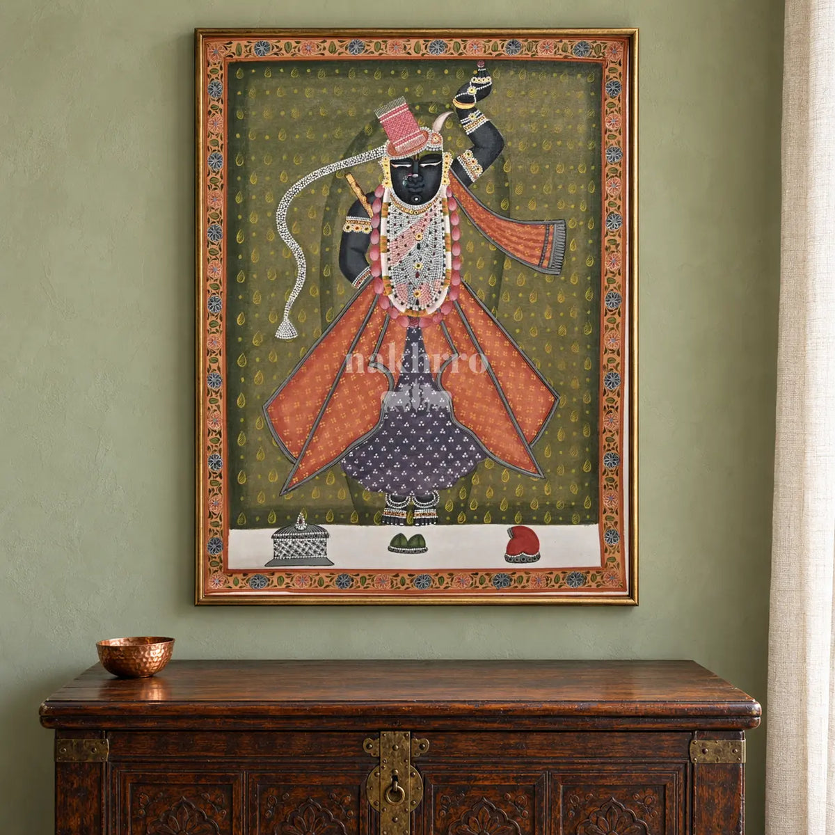 Shrinathji in Rose Robes on Olive — 18 × 24 inch original in a close collector setting, with Nakhrro watermark; styling visualisation