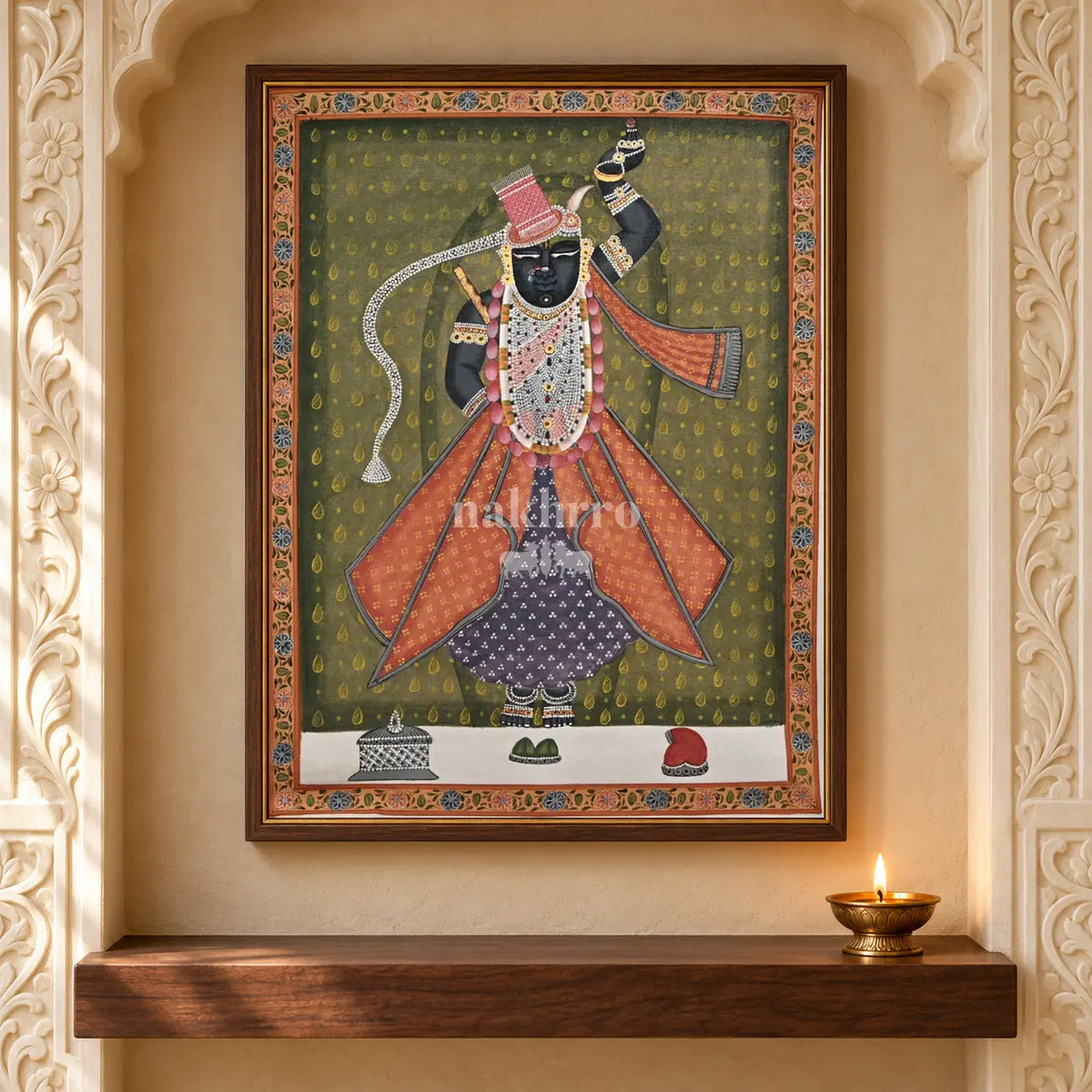 Shrinathji in Rose Robes on Olive — 18 × 24 inch original in a close niche setting, with Nakhrro watermark; styling visualisation