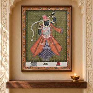Shrinathji in Rose Robes on Olive — 18 × 24 inch original in a close niche setting, with Nakhrro watermark; styling visualisation