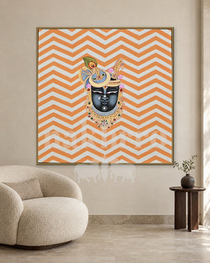 Shrinathji Portrait on Orange Chevrons — slim-frame room mockup 2 with Nakhrro watermark